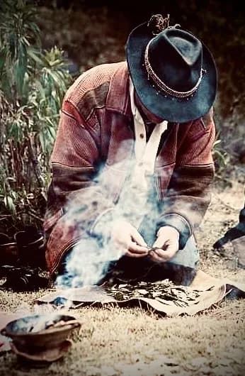 Hands holding sacred smoke in Peru